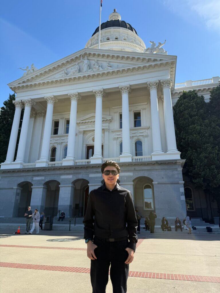 Anthony standing out front of the capitol building in Sacramento, CA
